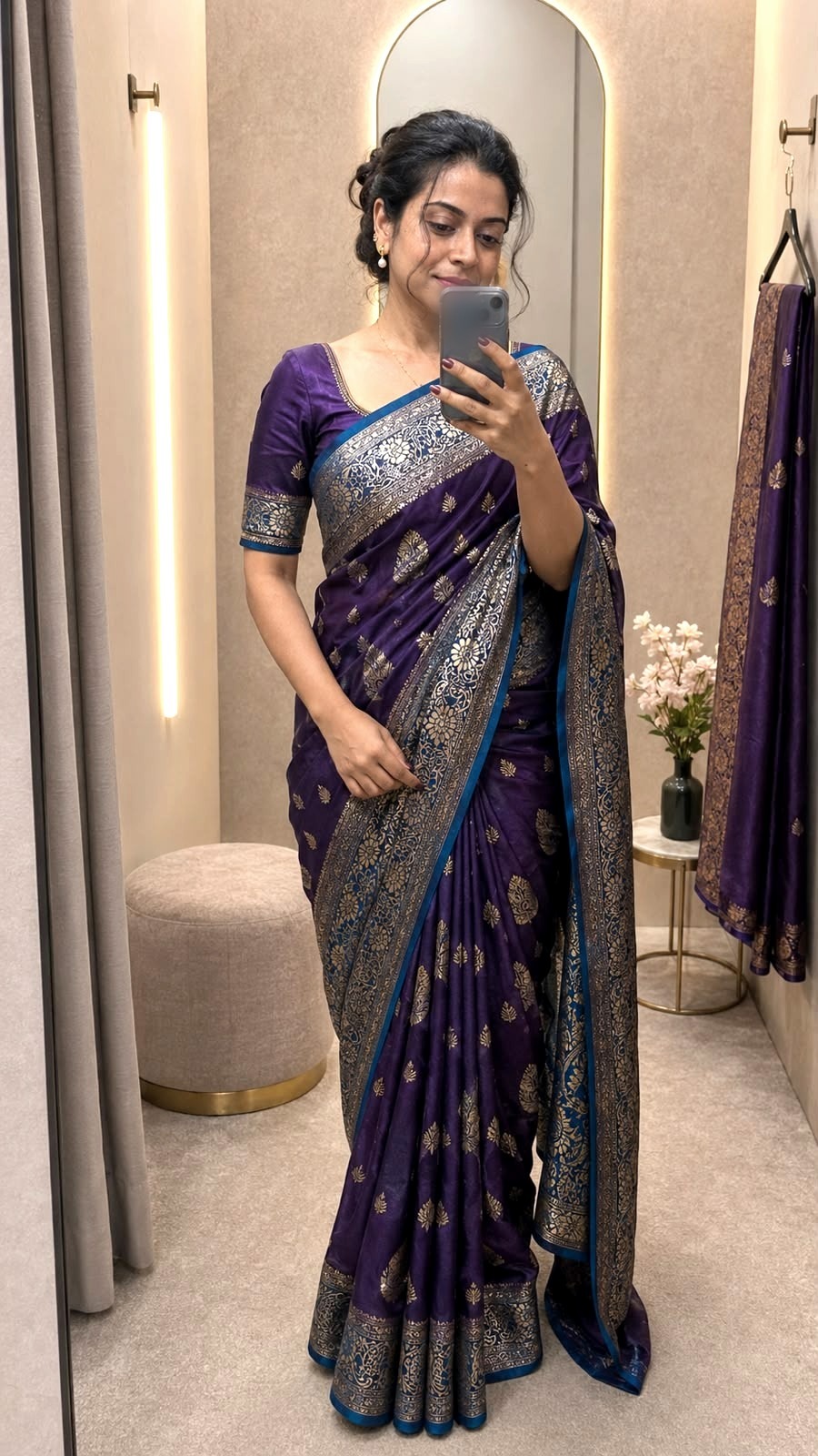 A deep aubergine Banarasi silk saree with gold zari booti and a meenakari border